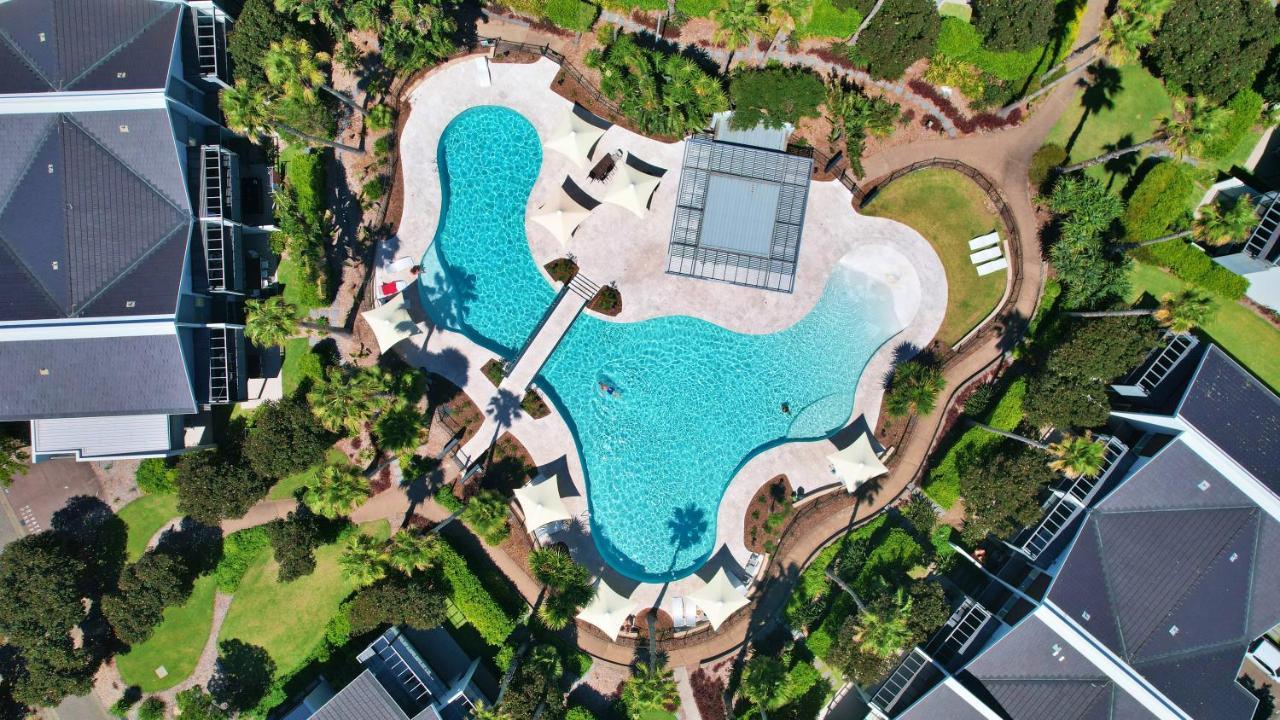 Pullman Magenta Shores Resort Entrance Exterior foto Aerial view of the pool at the 2018 Commonwealth Games